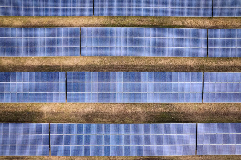 Aerial shot of solar panels arranged in a field in Rocky Mount, NC.